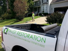 Power Washing a concrete driveway